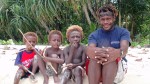 Our boat captain, Benson, and some local boys.