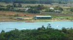 This is a water skiing park.  Tow ropes are tied to a cable that runs in a circle around the pond.