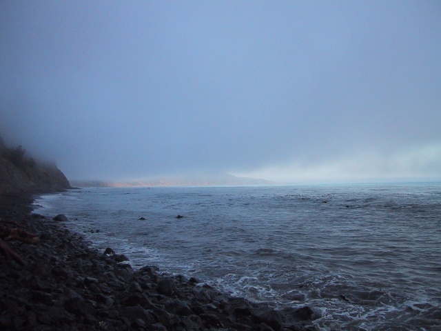 Shelter Cove in the distance.  Our campsite was just past that next promontory.  Luckily, this one was dry.