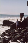 Chris helping Vicki scramble over the rocks.