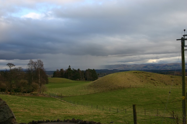 Scottish countryside with a rainshower off in the distance.