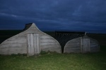 Storage sheds made from old boats.